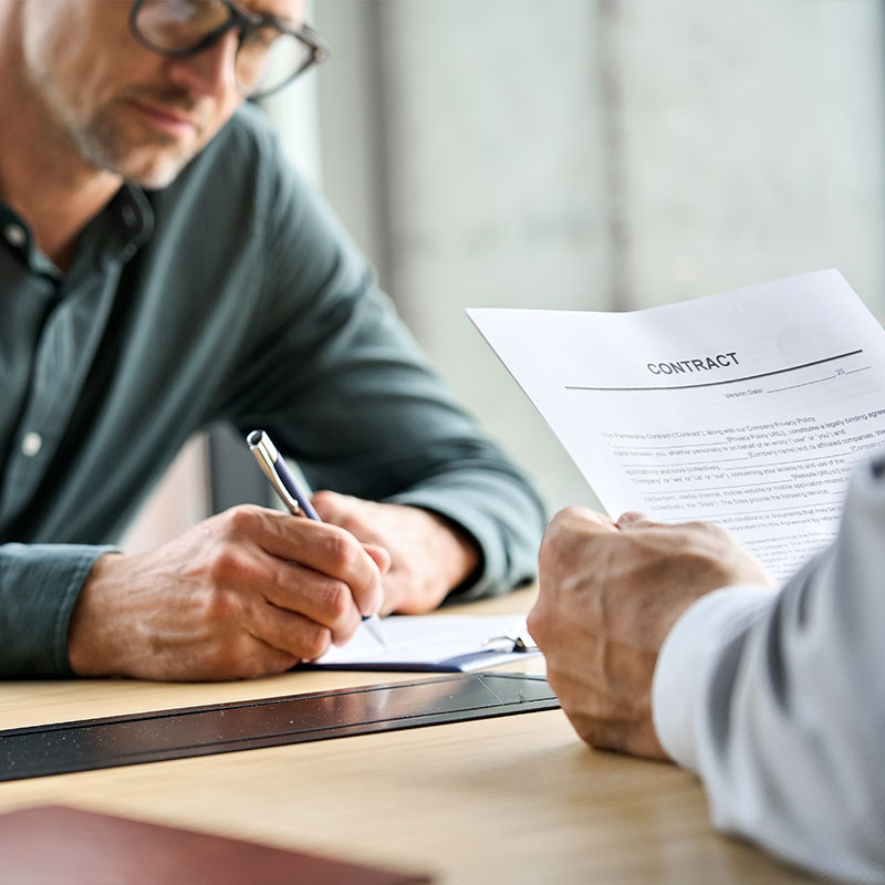 Client and attorney reviewing contract